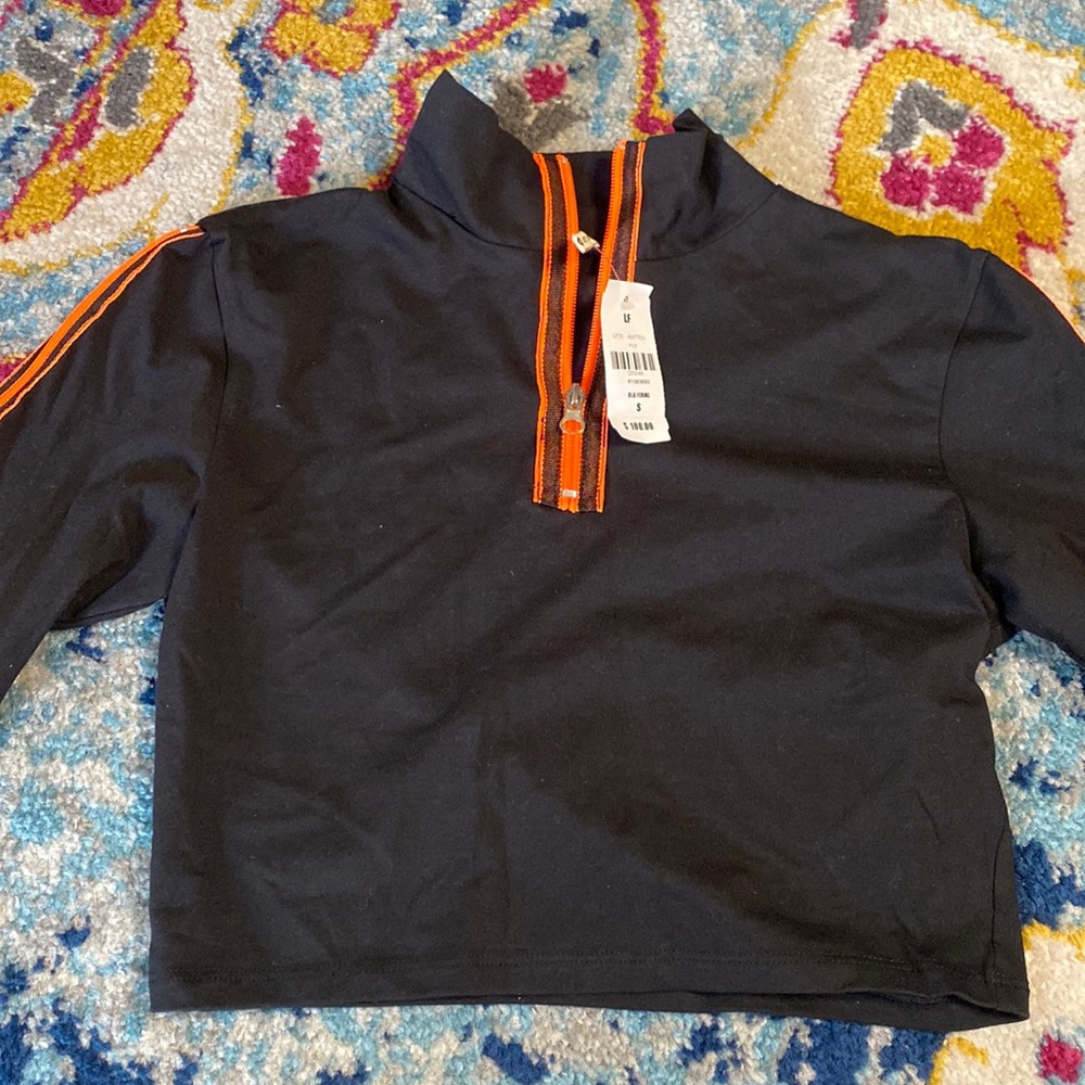 Black high neck crop with orange zipper detail
